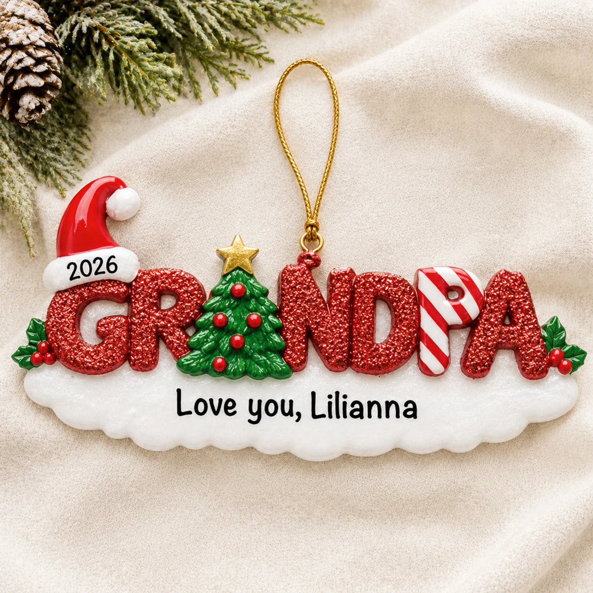 Personalized grandpa christmas ornament laid on a soft white knit blanket