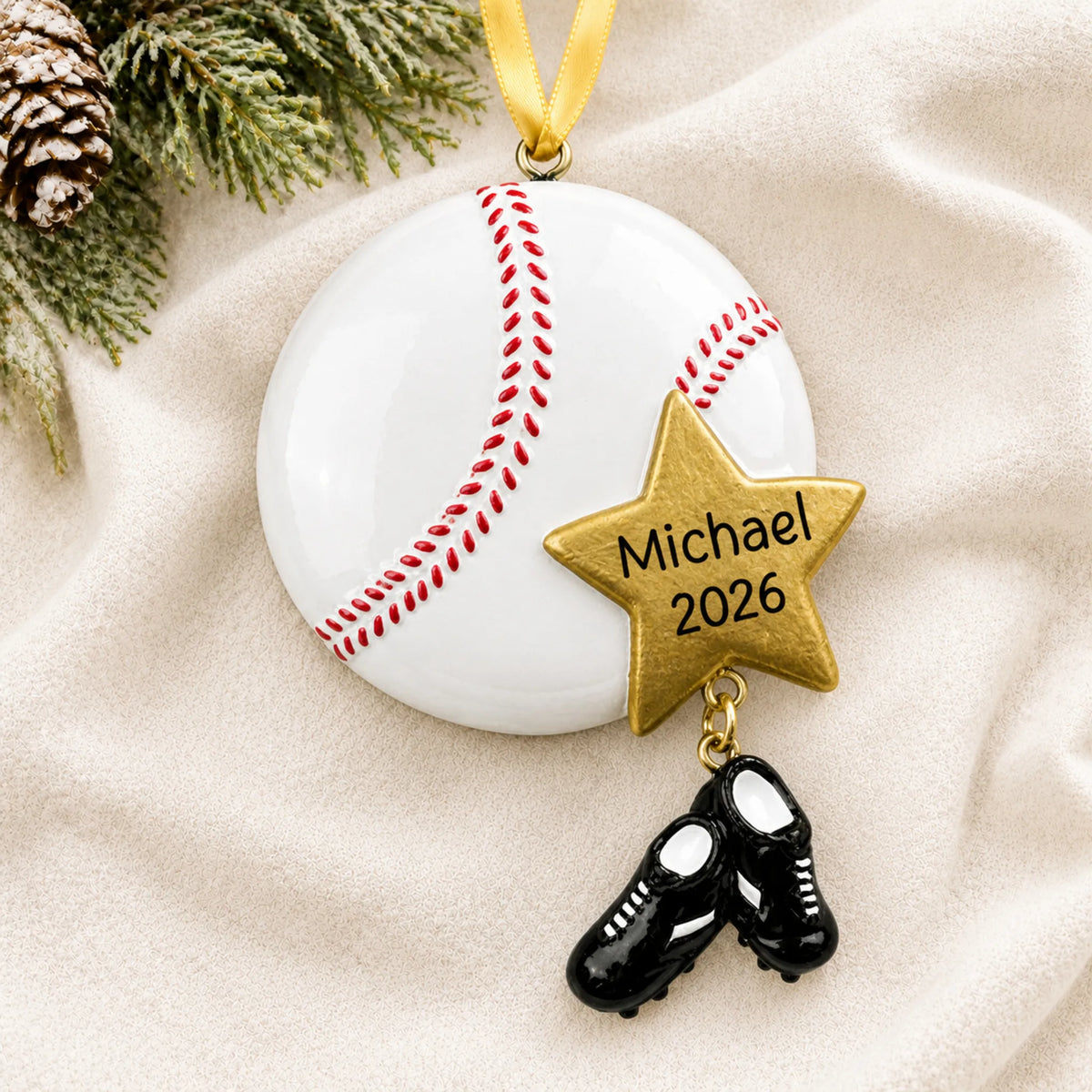 Personalized baseball star christmas ornament laid on a soft white knit blanket