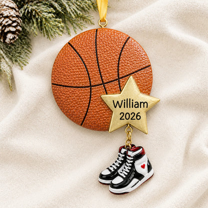 Personalized basketball star christmas ornament laid on a soft white knit blanket