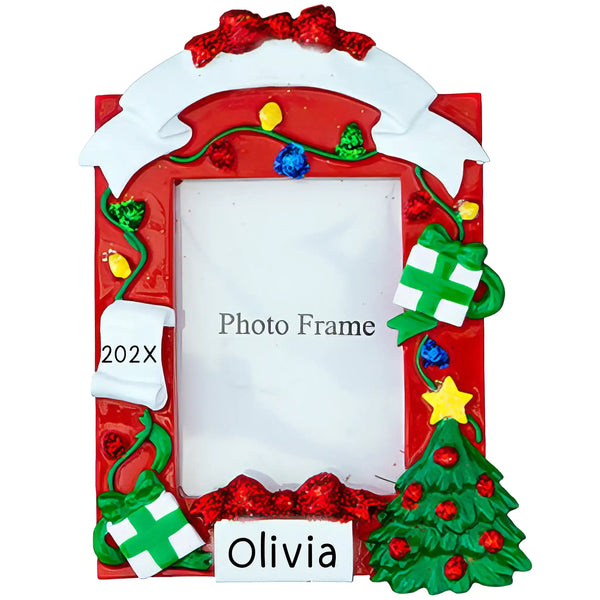 Personalized photo frame Christmas ornament decorated with red lights, green presents, and a Christmas tree, featuring a name tag (Olivia) and the year (202X) ready for a picture insert.