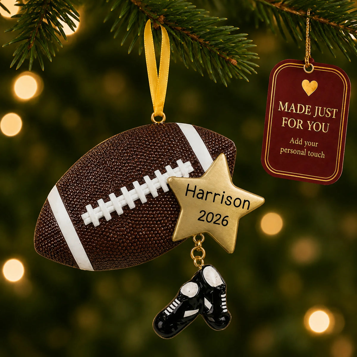 Football star christmas ornament hanging on a lit Christmas tree with a Made Just For You gift tag