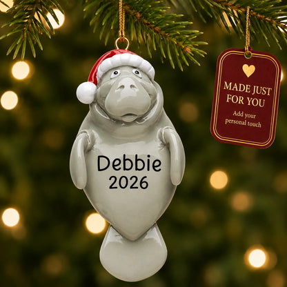 Manatee christmas ornament hanging on a lit Christmas tree with a Made Just For You gift tag