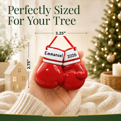 Size guide: the personalized boxing gloves christmas ornament shown in hand next to a Christmas tree