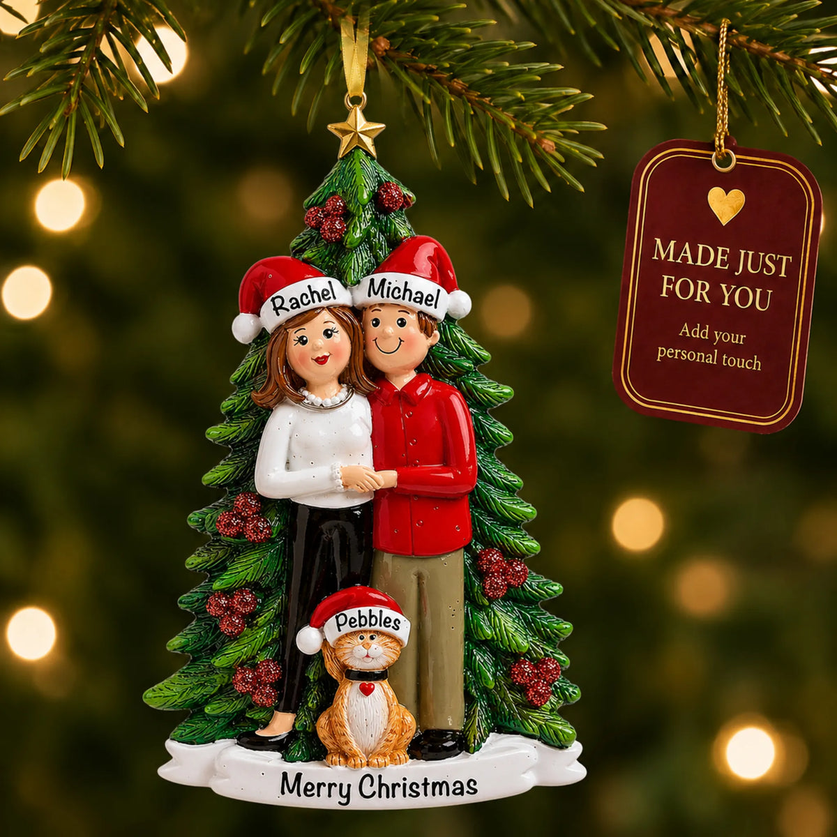 Couple with cat christmas ornament hanging on a lit Christmas tree with a Made Just For You gift tag