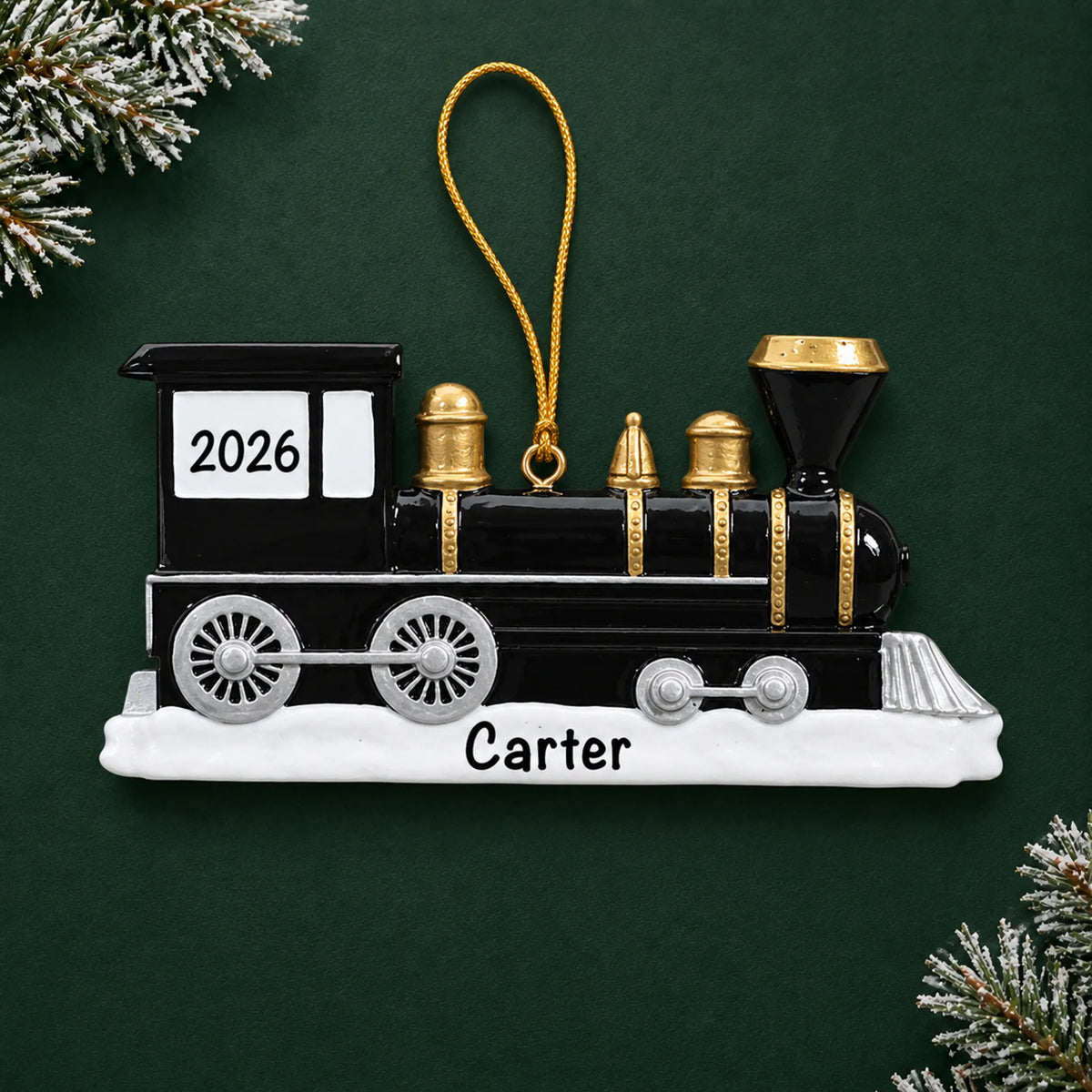 Personalized locomotive train christmas ornament on a dark green pine background