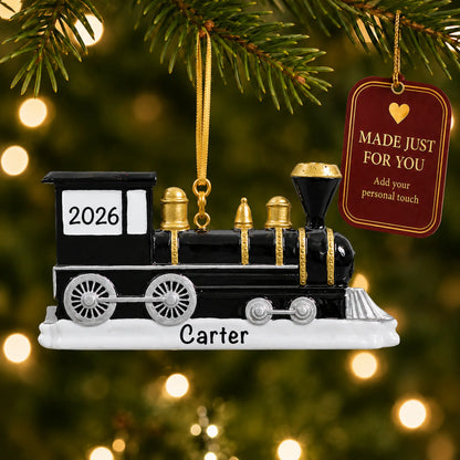 Locomotive train christmas ornament hanging on a lit Christmas tree with a Made Just For You gift tag