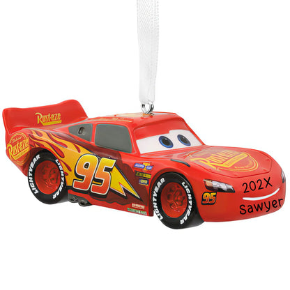 Personalized Christmas ornament featuring the red race car Lightning McQueen from Disney/Pixar Cars with number 95 and flame decals, ready for custom name engraving.