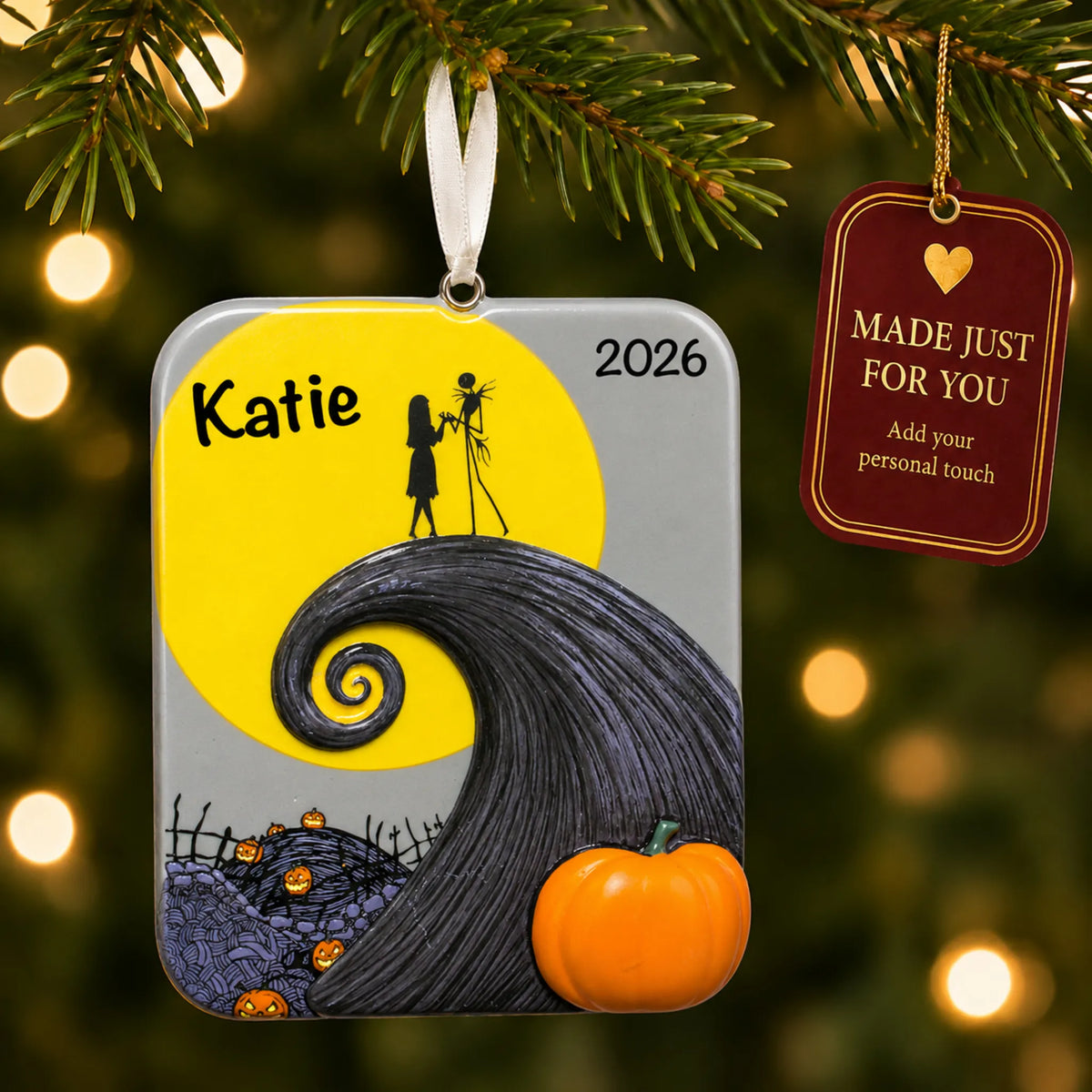 Nightmare Before Christmas ornament hanging on a lit Christmas tree with a Made Just For You gift tag