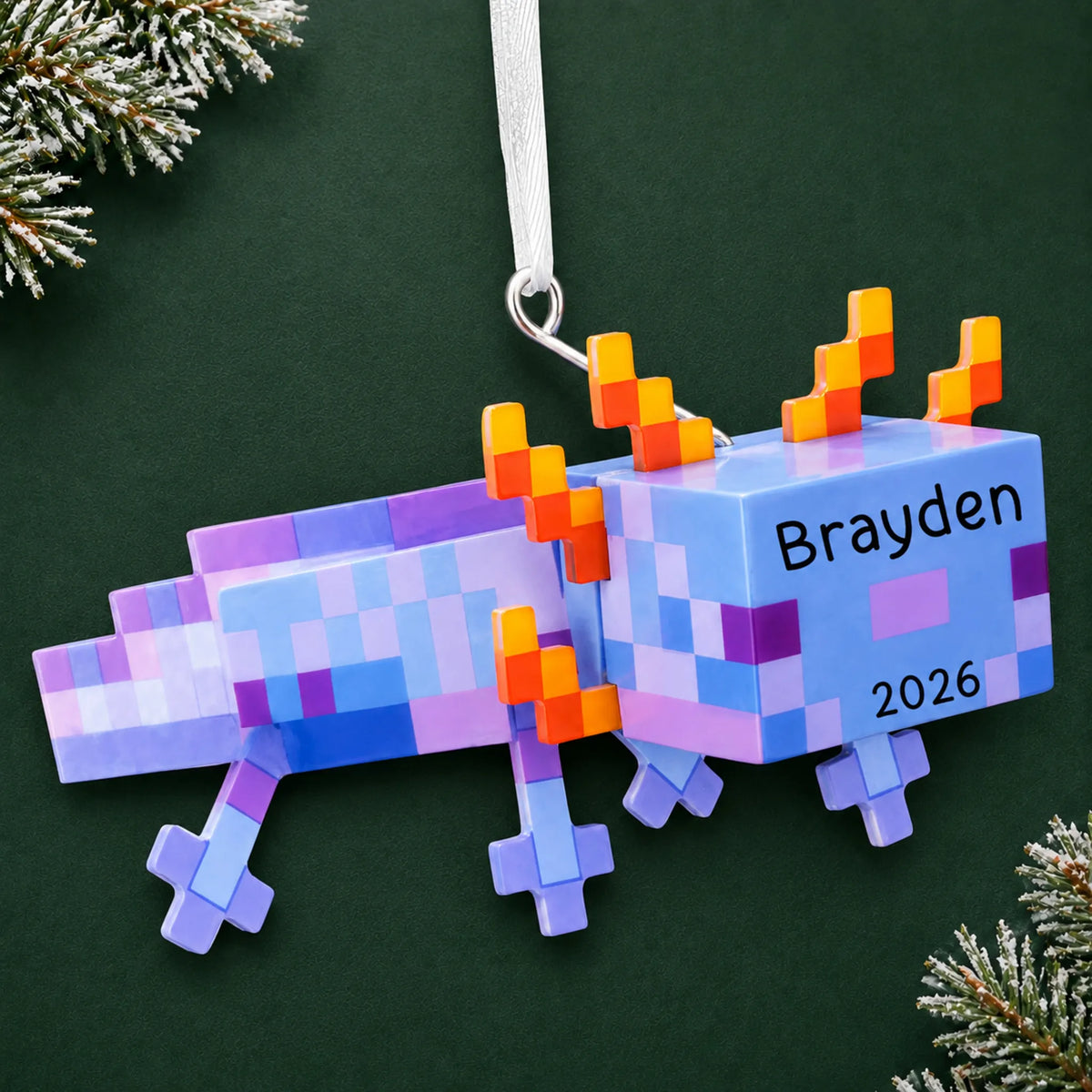 Personalized pixel video game axolotl christmas ornament on a dark green pine background