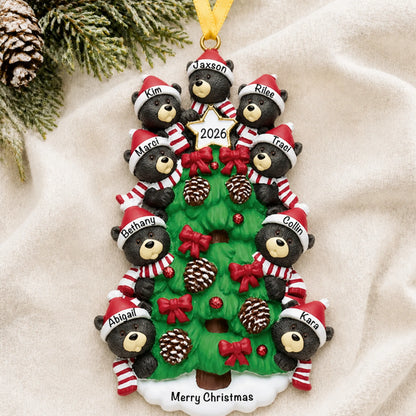 Personalized black bear tree family of 9 christmas ornament laid on a soft white knit blanket