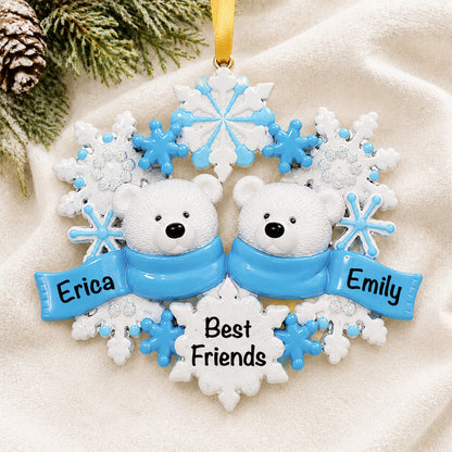 Personalized polar bear couple christmas ornament laid on a soft white knit blanket