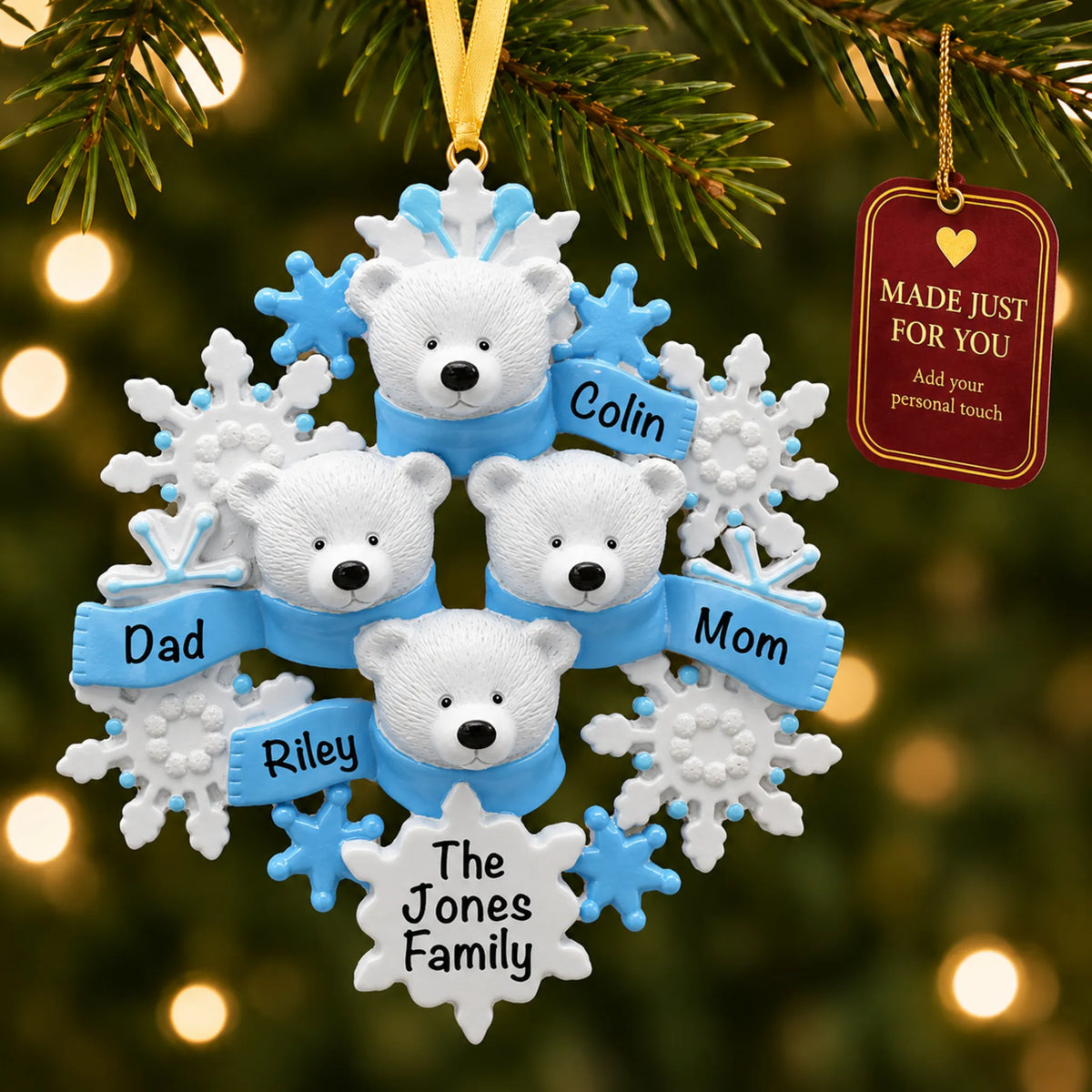 Polar bear family of 4 christmas ornament hanging on a lit Christmas tree with a Made Just For You gift tag