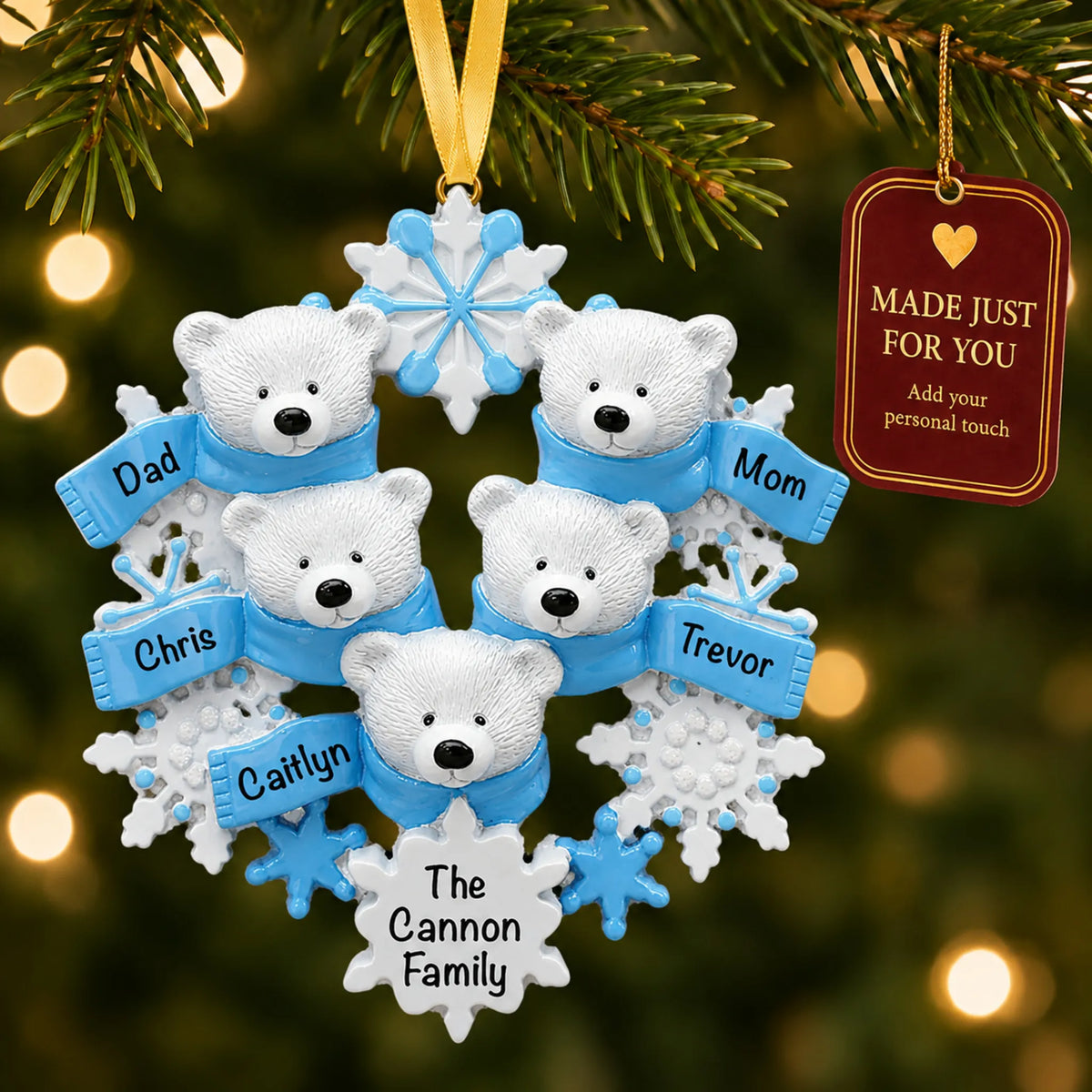 Polar bear family of 5 christmas ornament hanging on a lit Christmas tree with a Made Just For You gift tag