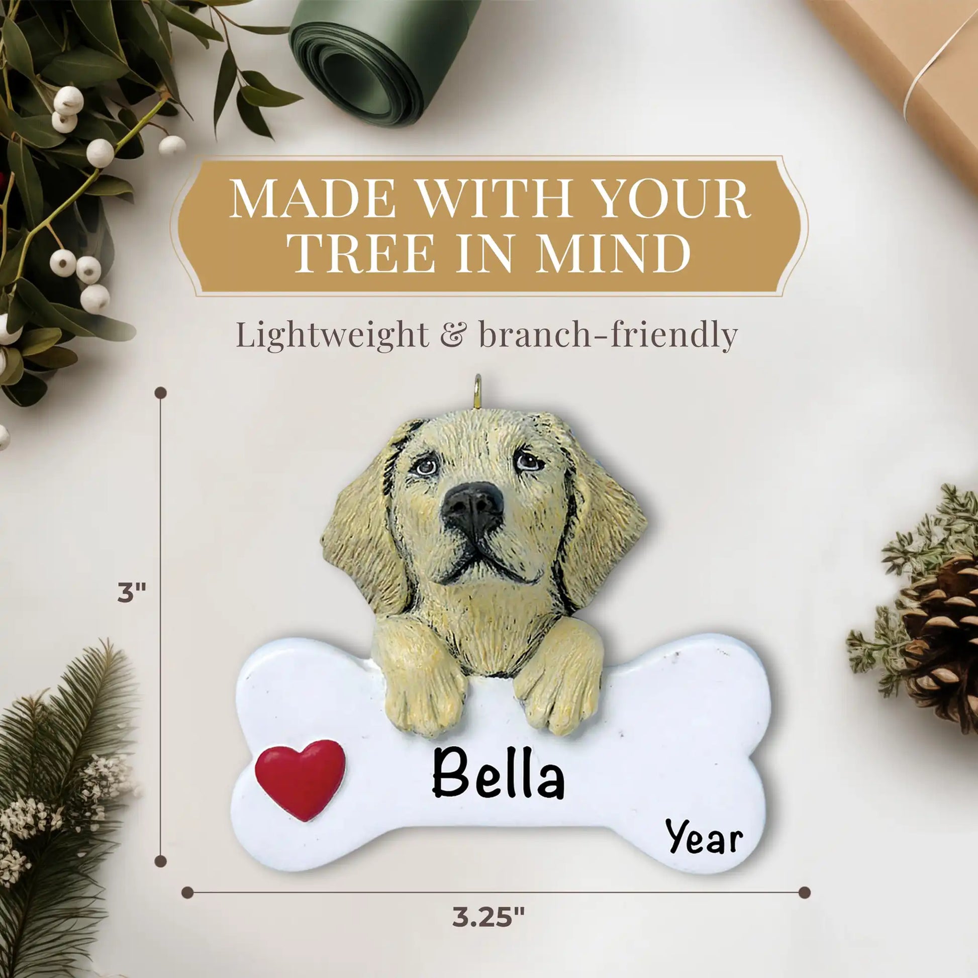 Personalized Yellow Labrador Christmas ornament with detailed cream-colored fur and dark eyes resting on white bone with red heart, customizable with dog's name and year