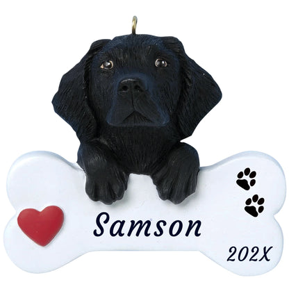 Personalized black Lab dog bone Christmas ornament, a glossy black pup with paws on a white bone, red heart, name and year