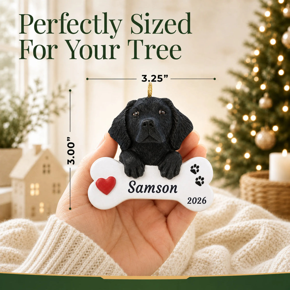 Size guide: the personalized Black Lab Dog Bone christmas ornament is 3.25 in wide by 3.00 in tall, shown in hand