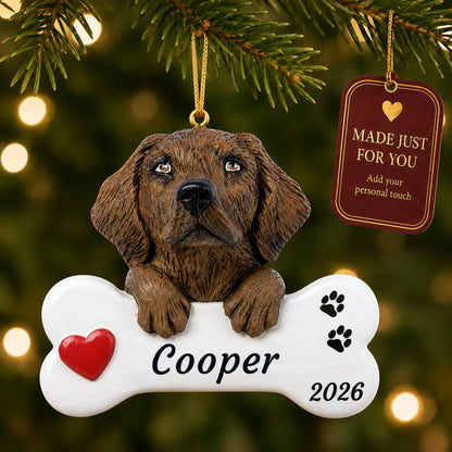 Chocolate Lab Dog Bone christmas ornament hanging on a lit Christmas tree with a Made Just For You gift tag