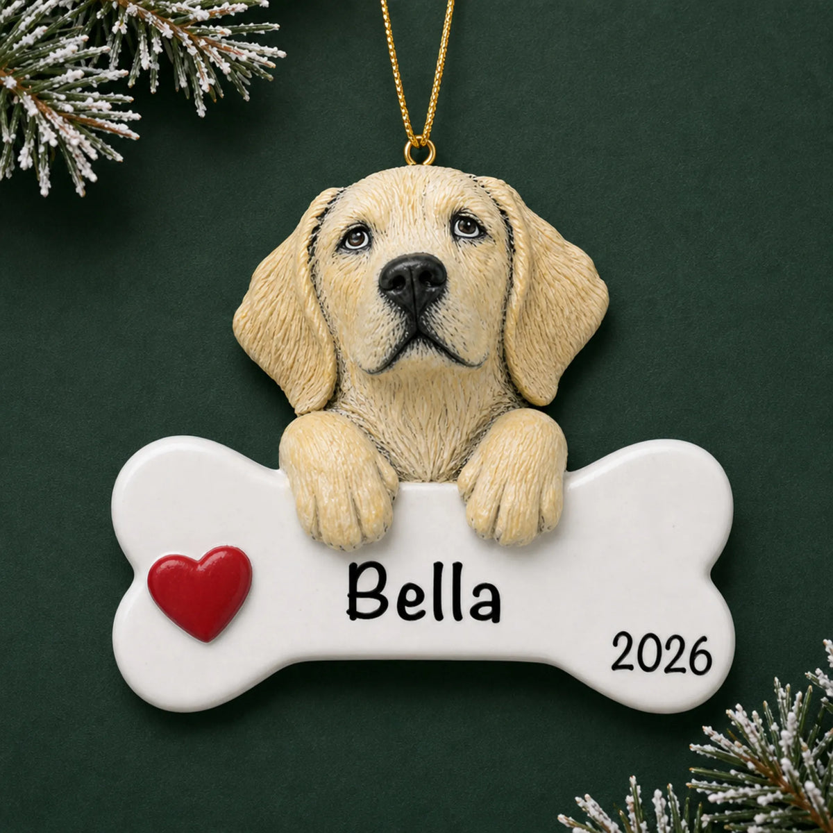 Personalized yellow Lab dog bone Christmas ornament, engraved with a name and year, on a green holiday backdrop