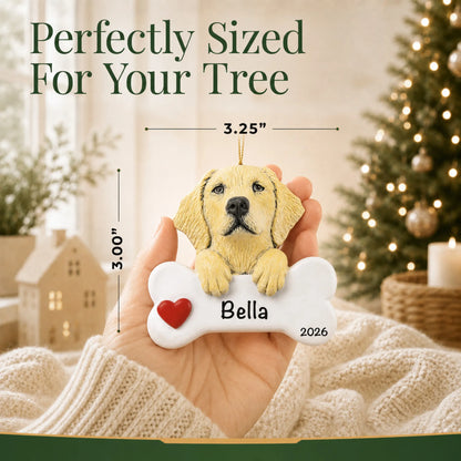 Hand holding the personalized yellow Lab Christmas ornament to show its 3.25 inch width