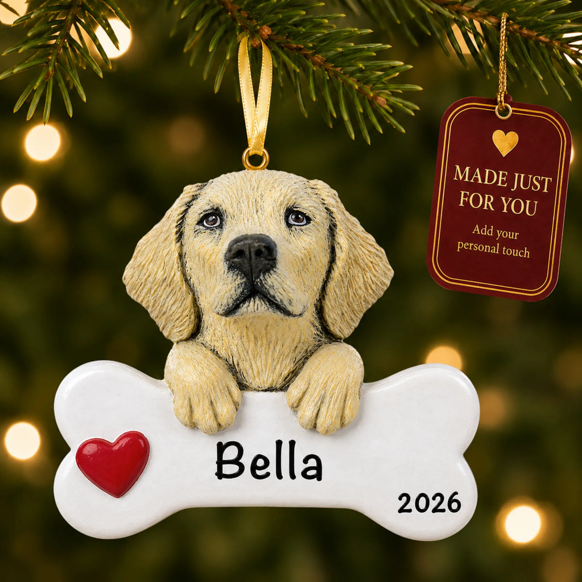 Personalized yellow Lab Christmas ornament hanging on a lit tree beside a Made Just For You tag