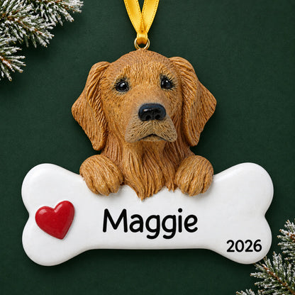 Personalized golden retriever dog bone Christmas ornament, engraved with a name and year, on a green holiday backdrop