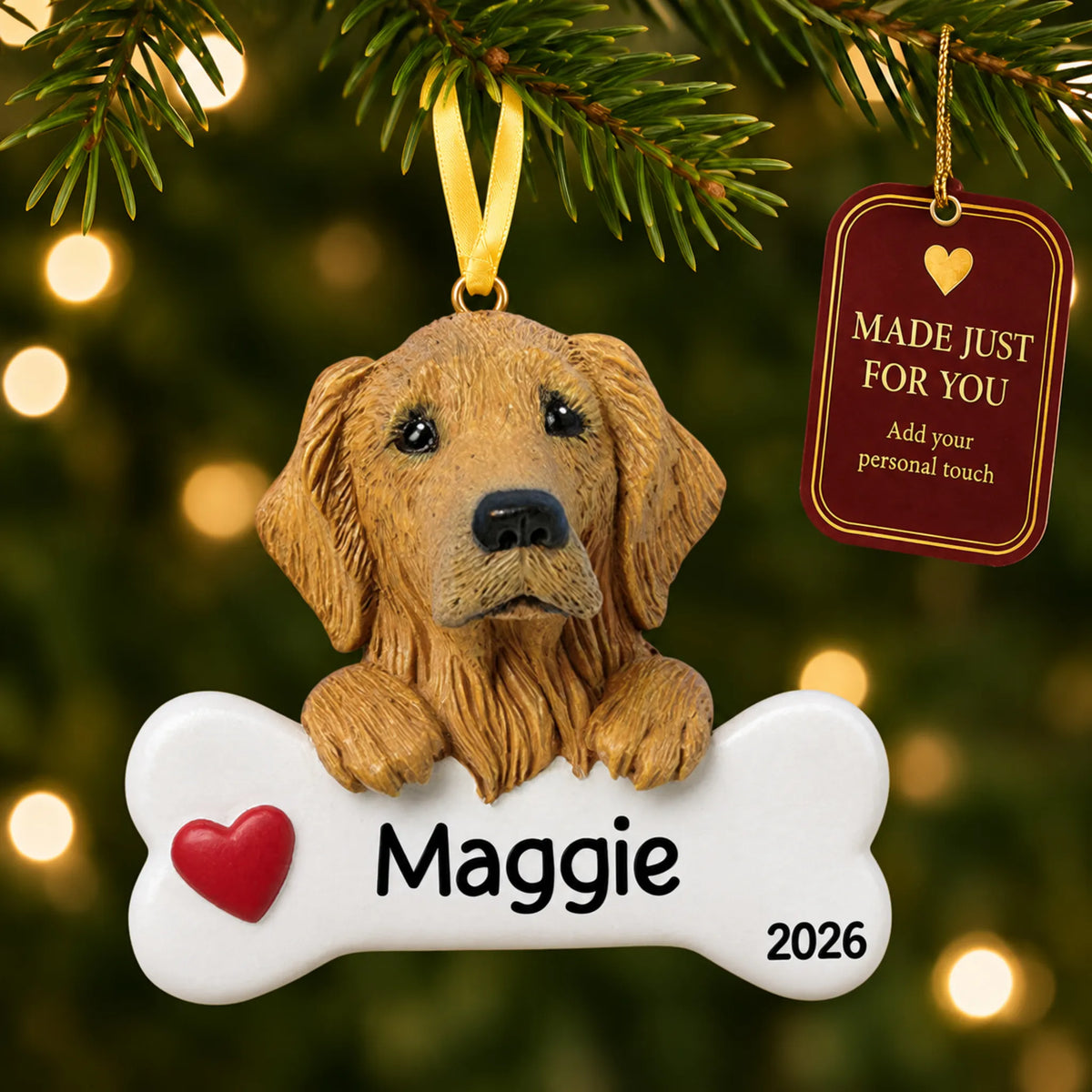Personalized golden retriever Christmas ornament hanging on a lit tree beside a Made Just For You tag
