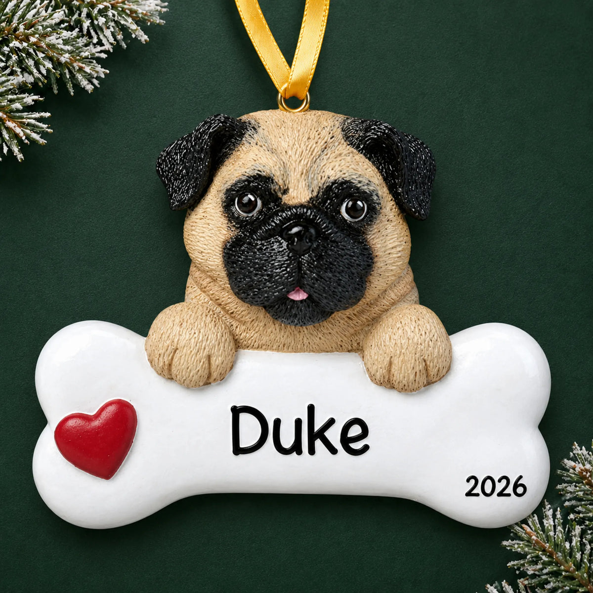 Personalized pug dog bone Christmas ornament with a red heart, engraved name and year on a green holiday backdrop