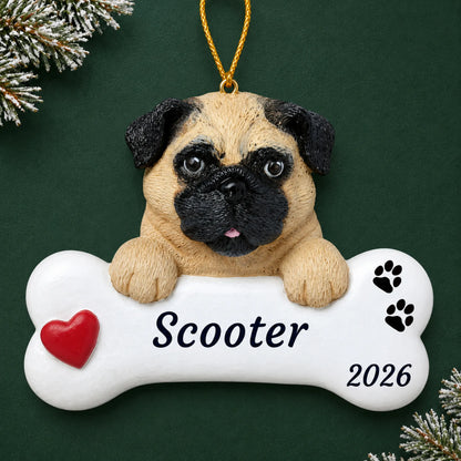 Personalized pug dog bone Christmas ornament with a red heart, engraved name and year on a green holiday backdrop