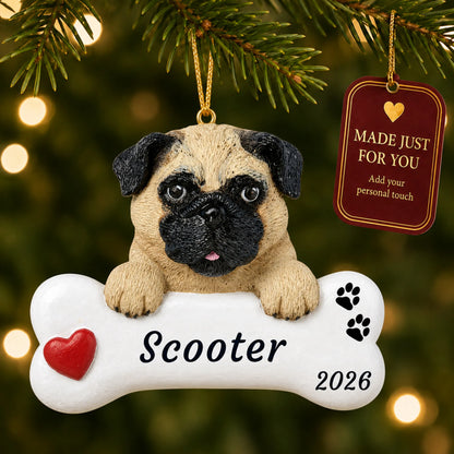 Personalized pug Christmas ornament hanging on a lit tree beside a Made Just For You tag