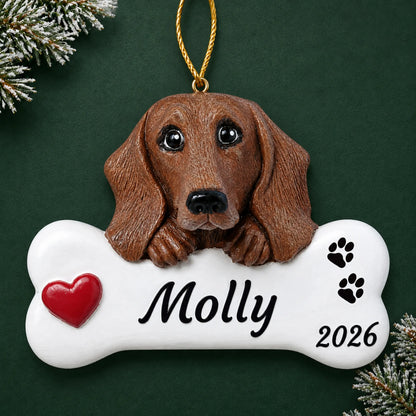Personalized Dachshund Dog Bone christmas ornament on a dark green pine background