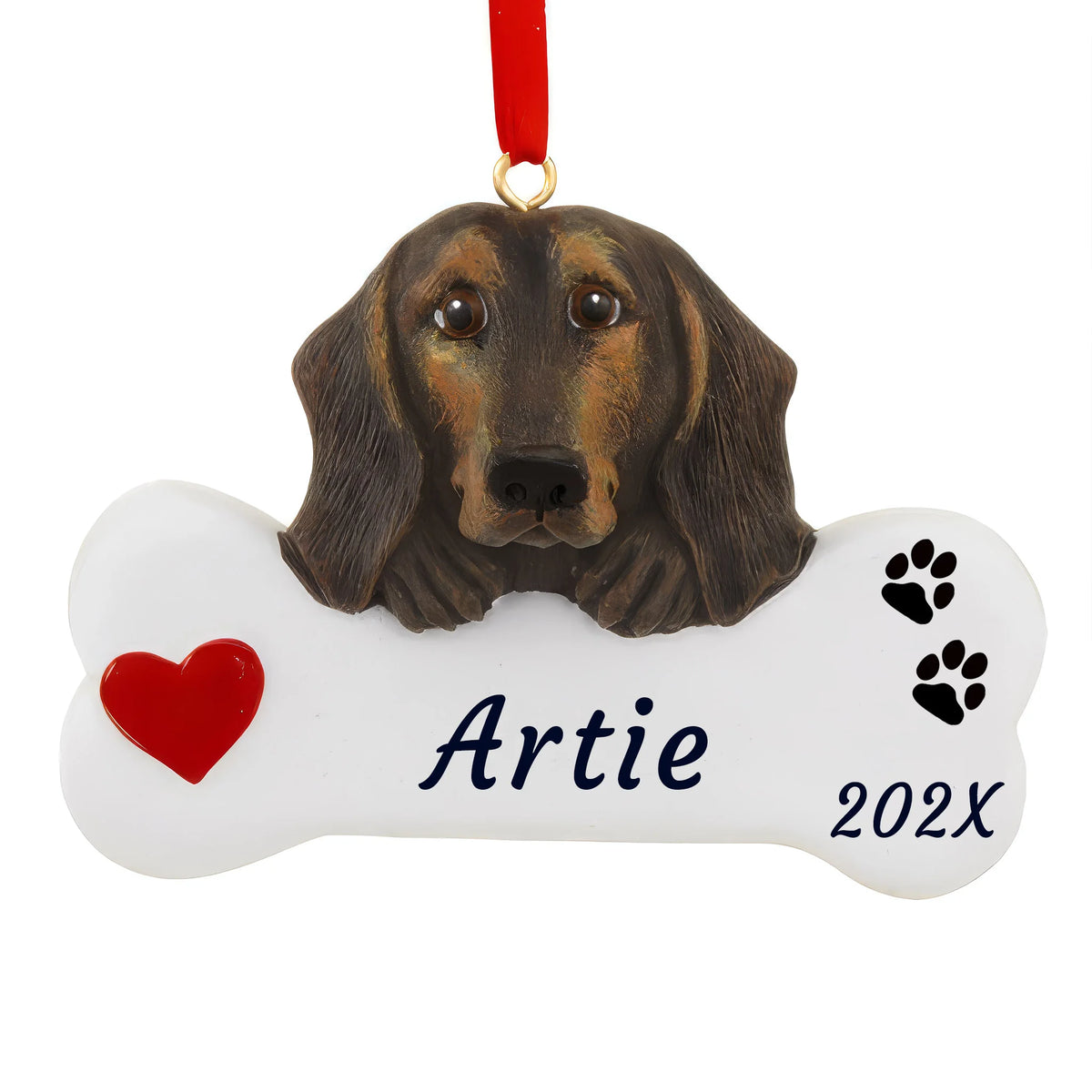 Personalized black and tan dachshund dog bone Christmas ornament on a red ribbon, white bone with a red heart, name and year