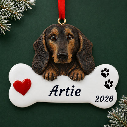 Personalized Black & Tan Dachshund Dog Bone christmas ornament on a dark green pine background