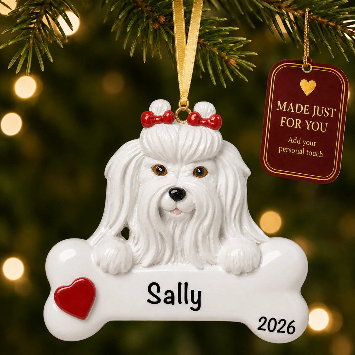 Personalized Maltese Christmas ornament hanging on a lit tree beside a Made Just For You tag