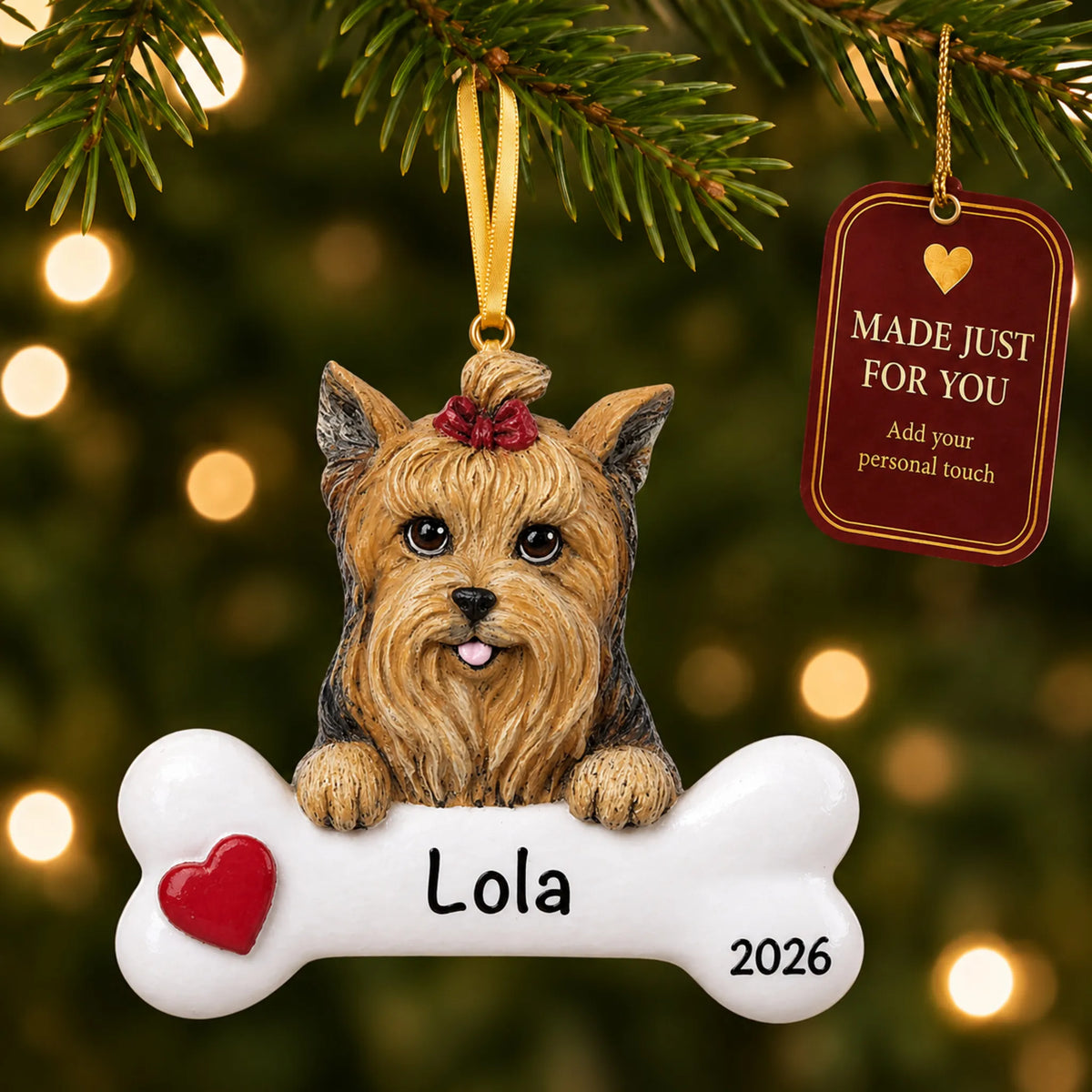 Personalized Yorkie Christmas ornament hanging on a lit tree beside a Made Just For You tag