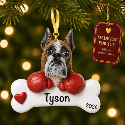 Personalized boxer Christmas ornament hanging on a lit tree beside a Made Just For You tag