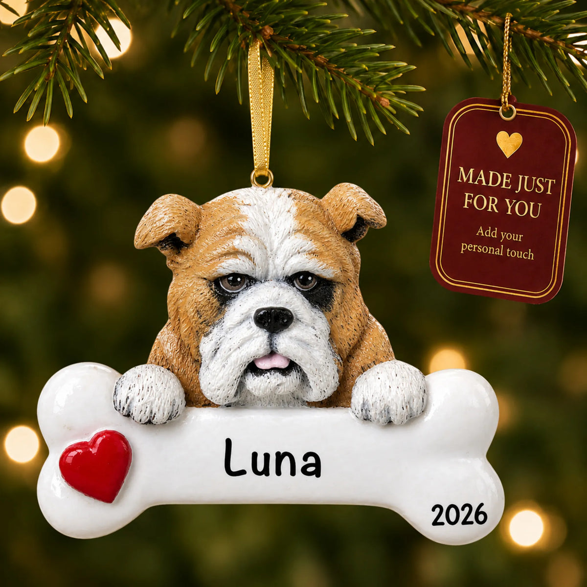 Personalized bulldog Christmas ornament hanging on a lit tree beside a Made Just For You tag