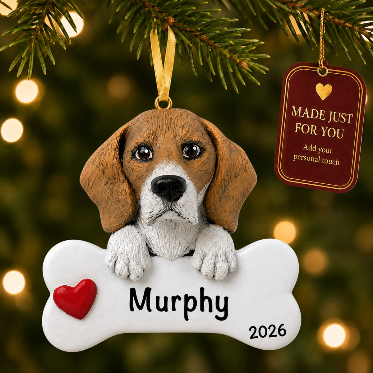 Personalized beagle Christmas ornament hanging on a lit tree beside a Made Just For You tag