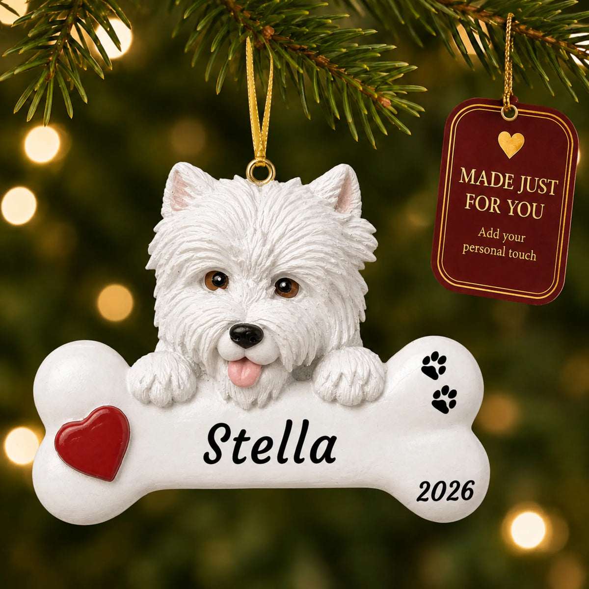 Westie Dog Bone christmas ornament hanging on a lit Christmas tree with a Made Just For You gift tag