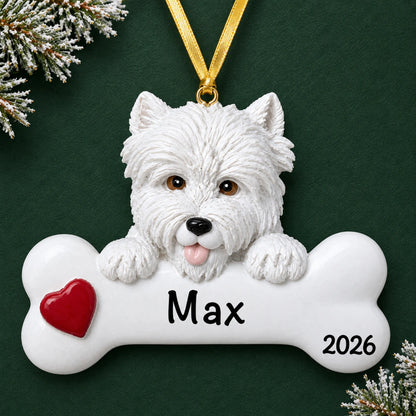 Personalized Westie dog bone Christmas ornament, engraved with a name and year, on a green holiday backdrop