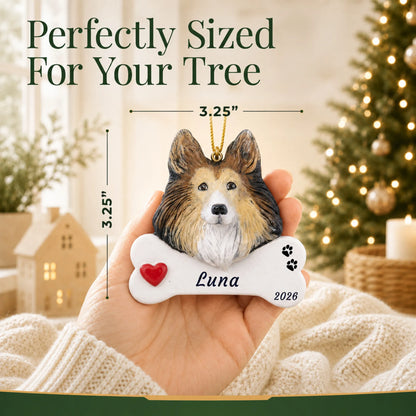 Size guide: the personalized Collie Dog Bone christmas ornament is 3.25 in wide by 3.25 in tall, shown in hand