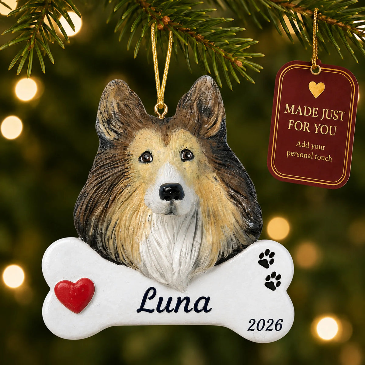 Collie Dog Bone christmas ornament hanging on a lit Christmas tree with a Made Just For You gift tag