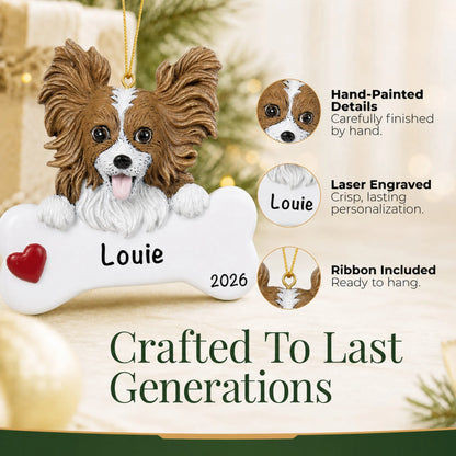 Close-up of the personalized papillon Christmas ornament showing hand-painted details and laser engraving