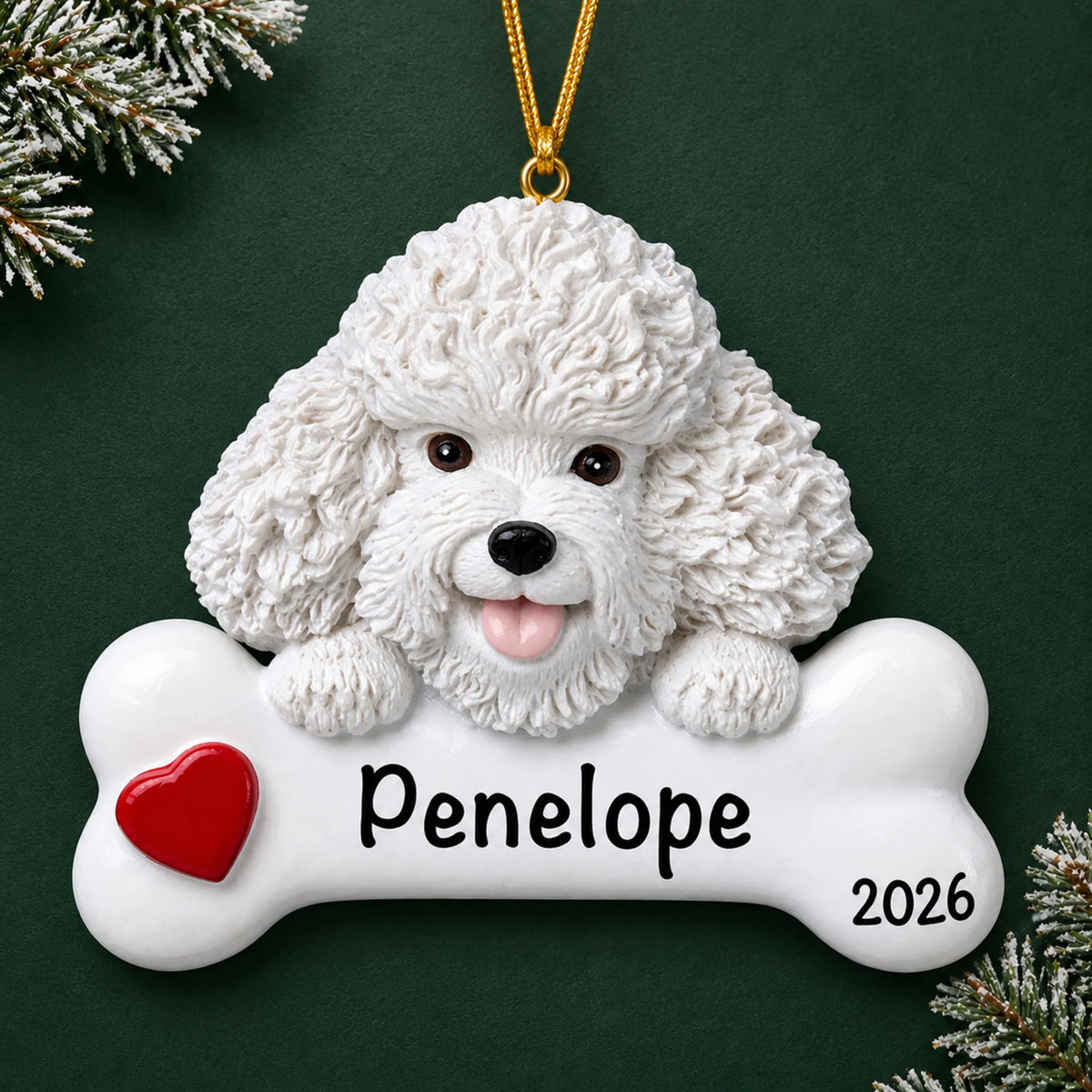 Personalized Bichon Frise dog bone Christmas ornament, engraved with a name and year, on a green holiday backdrop
