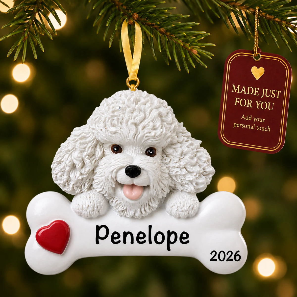 Personalized Bichon Frise Christmas ornament hanging on a lit tree beside a Made Just For You tag