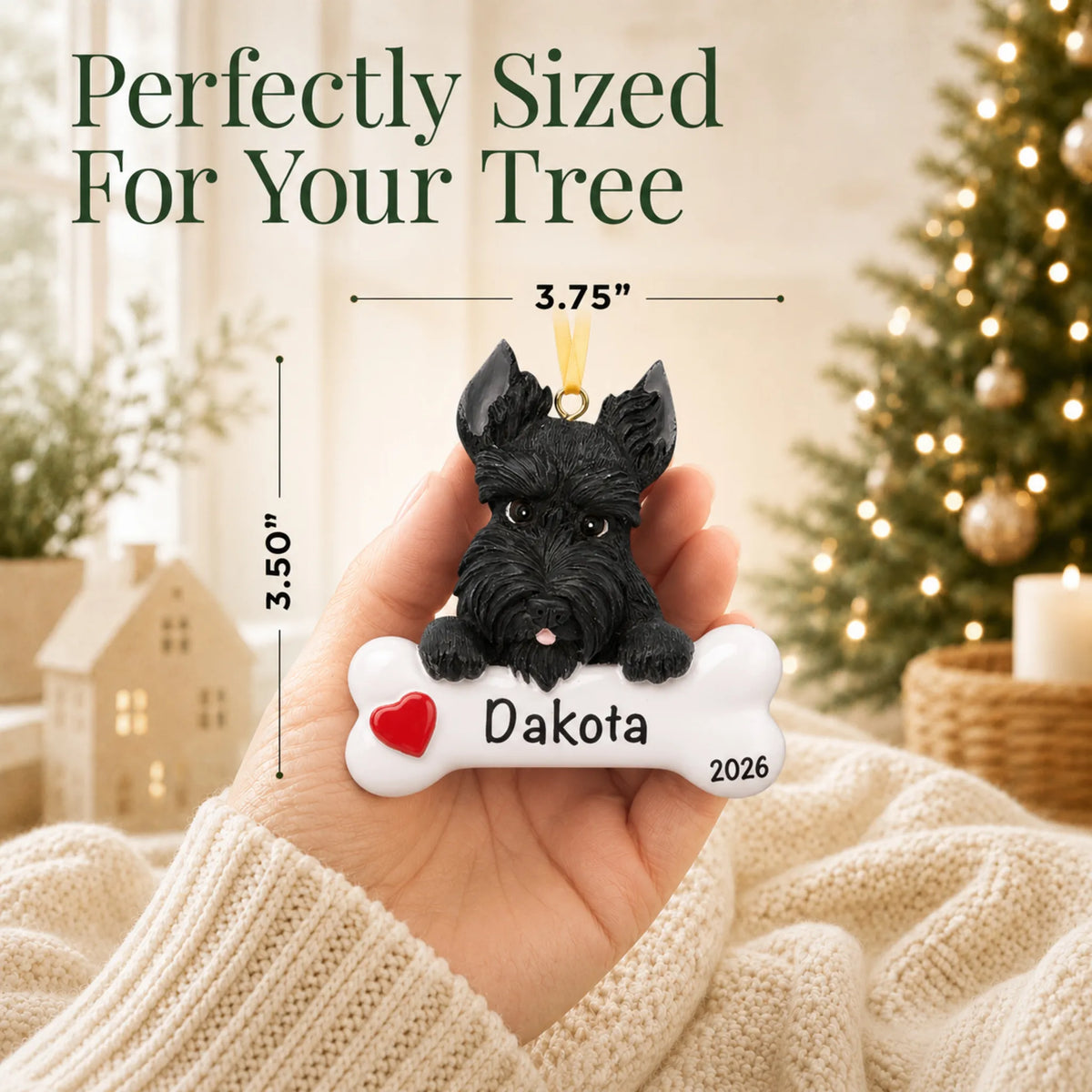Hand holding the personalized Scottie Christmas ornament to show its 3.75 inch width