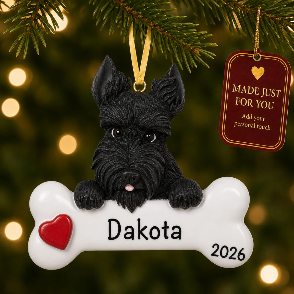Personalized Scottie Christmas ornament hanging on a lit tree beside a Made Just For You tag
