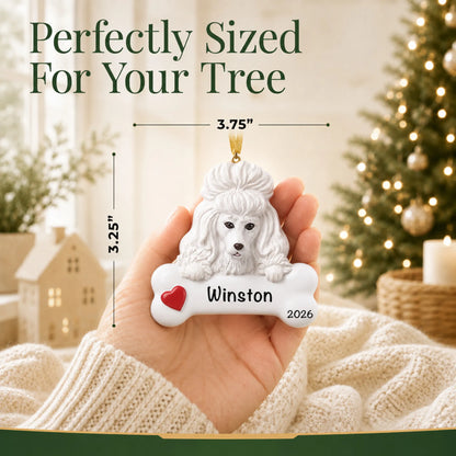 Hand holding the personalized white poodle Christmas ornament to show its 3.75 inch width