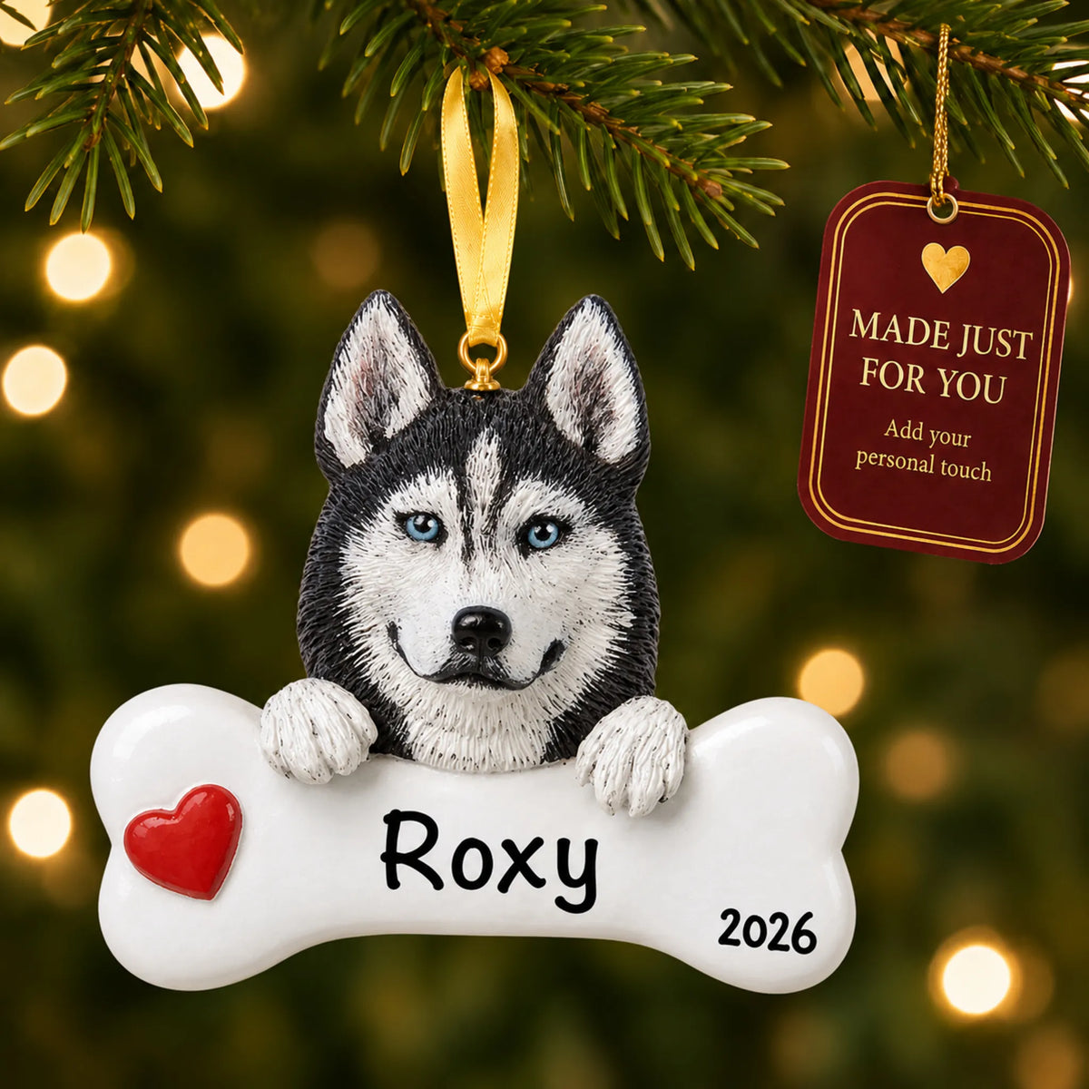 Personalized Siberian husky Christmas ornament hanging on a lit tree beside a Made Just For You tag