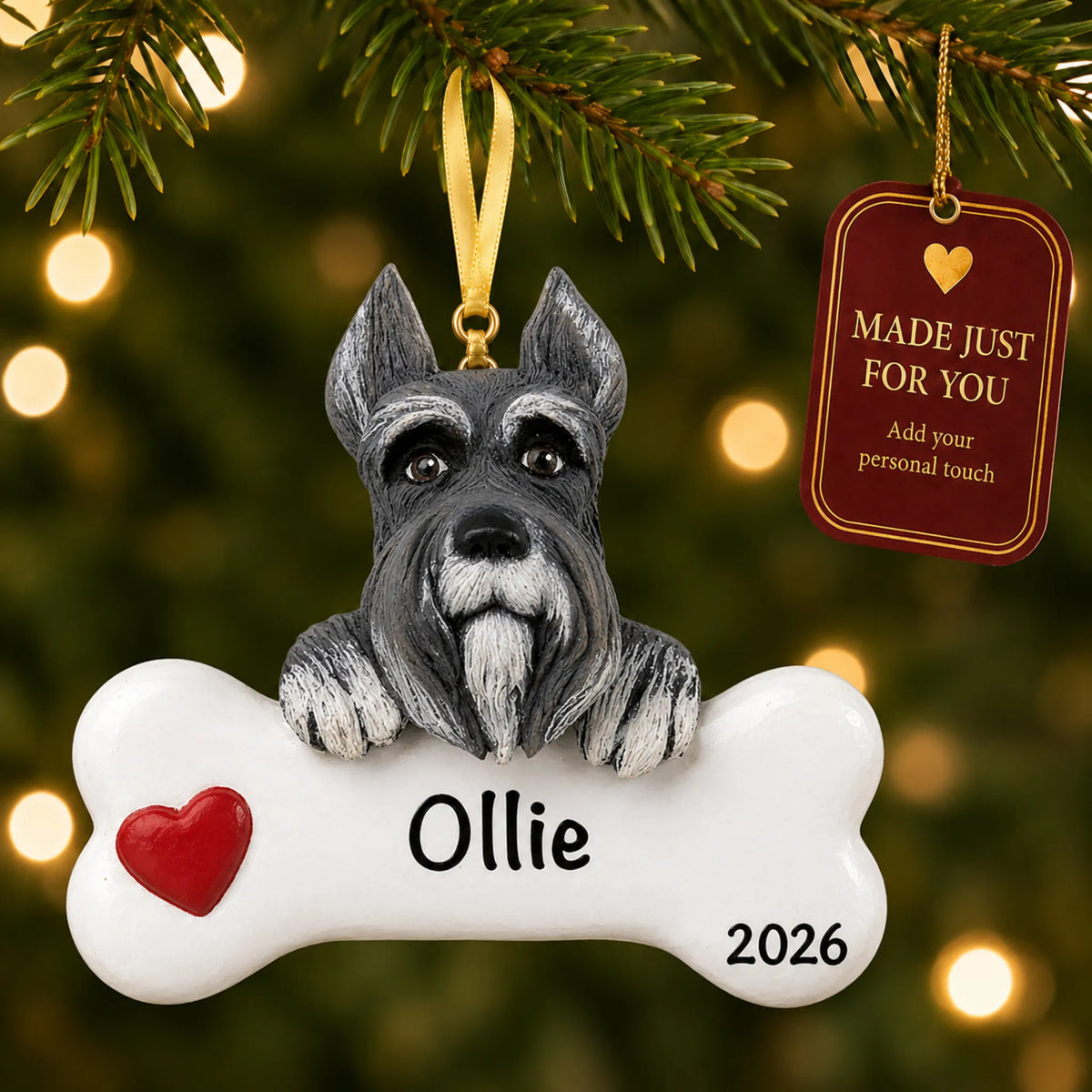 Personalized schnauzer Christmas ornament hanging on a lit tree beside a Made Just For You tag