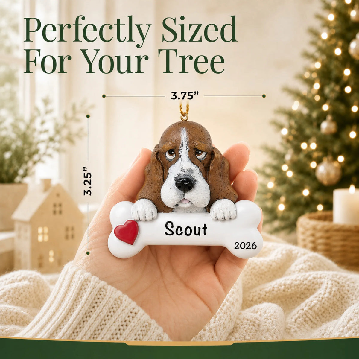 Hand holding the personalized basset hound Christmas ornament to show its 3.75 inch width